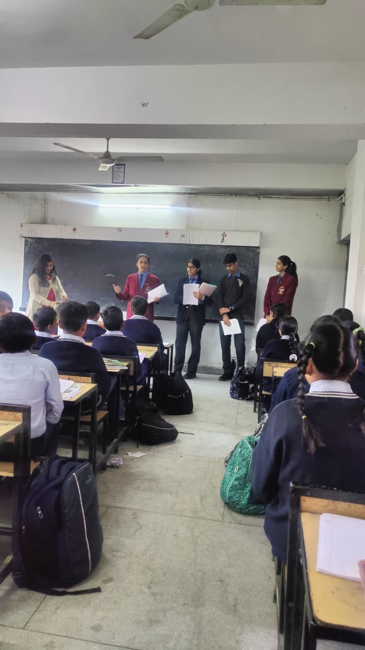 Volunteers leading a destigmatisation panel in a school classroom
